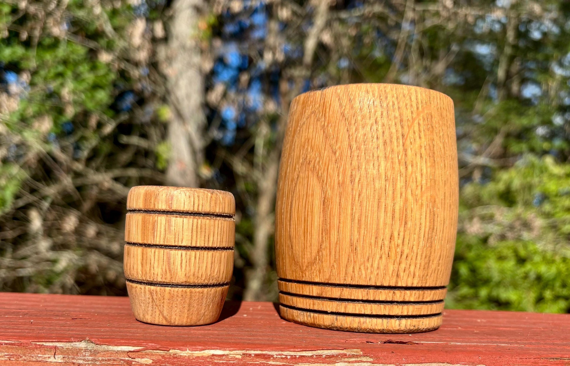 Handmade Charred White Oak Whiskey Shot Glass (pictured on the left) and our exquisite full size Whiskey Cup (featured on the right).